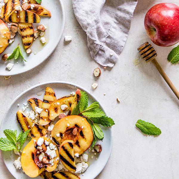 ROASTED PEACHES AND ENVY™ APPLES WITH WARM HAZELNUT VINAIGRETTE