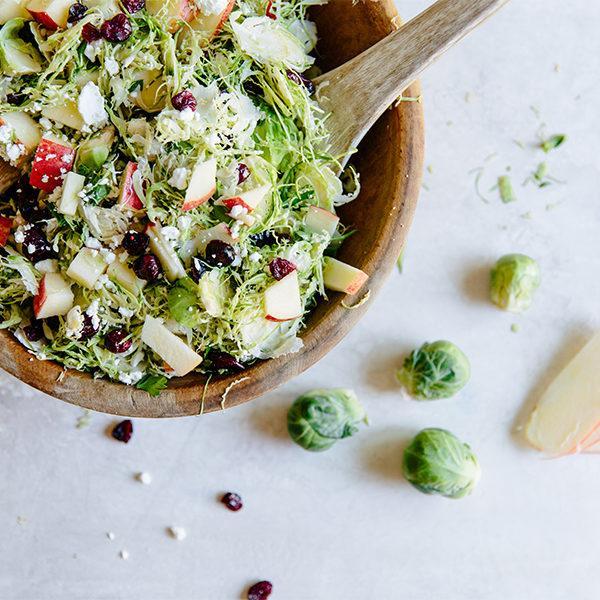 SHAVED BRUSSELS SPROUT SALAD WITH ENVY™ APPLES AND CRANBERRY VINAIGRETTE